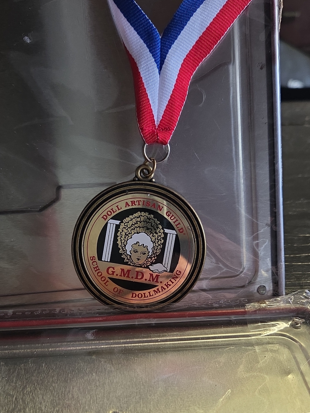 G.M.D.M Dollmaking Medal with Red White Blue Ribbon